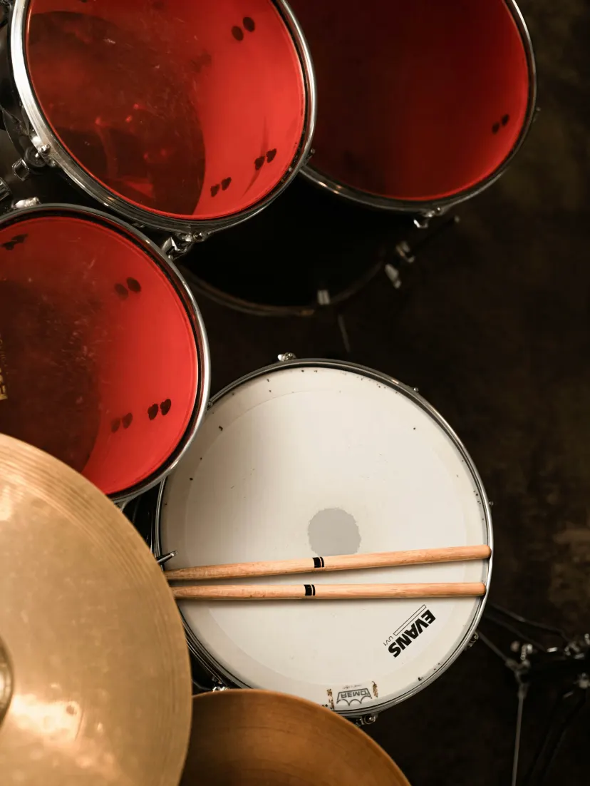 Drummer playing a drum kit in a music studio in Australia