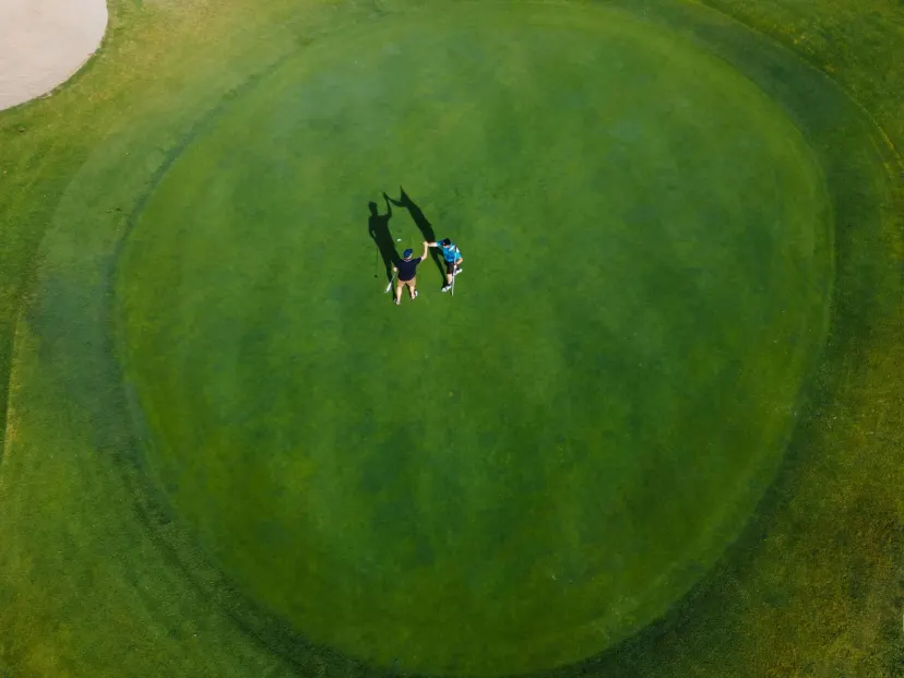 Golfers playing a round together on a sunny Australian golf course